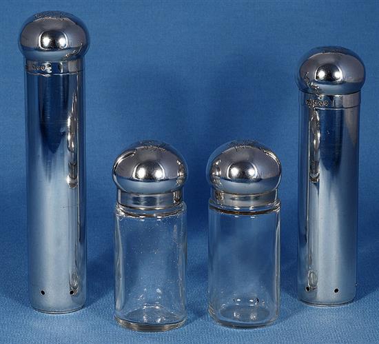 Four late Victorian dressing table cylindrical jars, tallest 176mm. Weight of silver 10.4oz/325 grams.